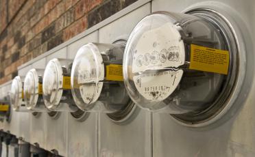 An image showing a row of power meters on an outside wall.