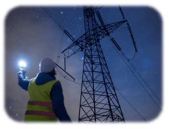 Electricity pylon in a dark star lit night with a maintenane worker holding a torch up to the sky