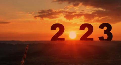 An abstract image of a sunset with 2023 in the foreground.